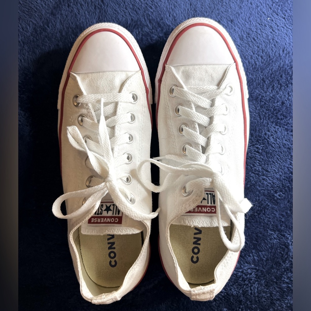 Brand new. Never worn. White classic All Star Converse sneakers.